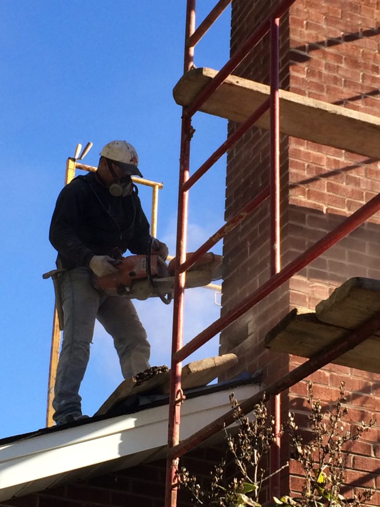 Crew member geared on scaffold